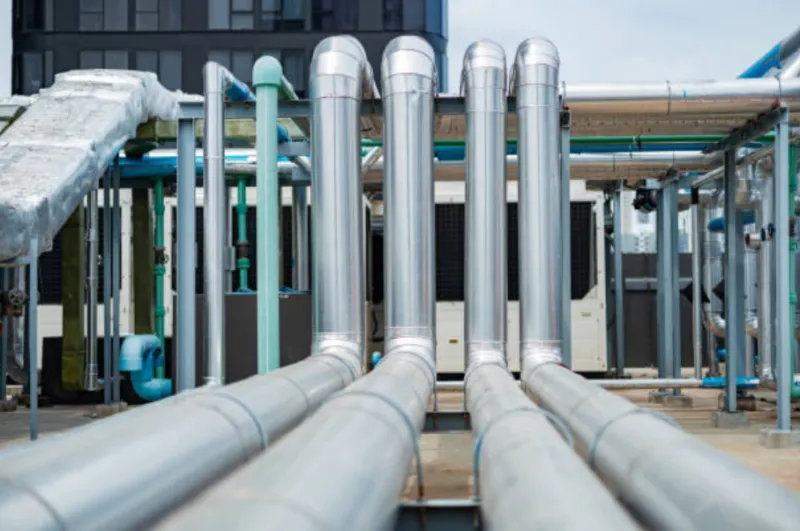 A photo of industrial pipes built to flex and move when temperatures change.